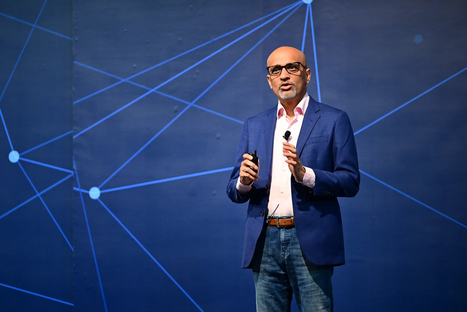 Ritesh Vajariya delivering an AI keynote on stage